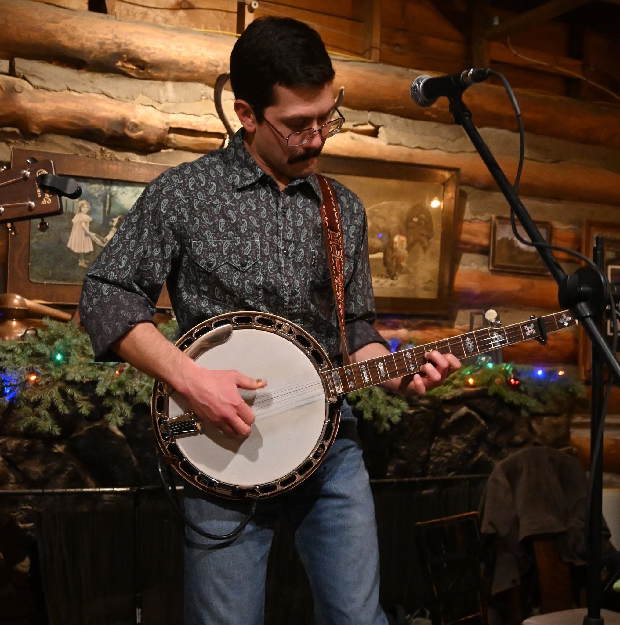 Elijah Donovan playing banjo